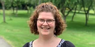 Colour head and shoulders photo of Heather Major smiling at the camera