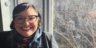 Colour photo of Sophia Magallanes-Tsang sm,iling at the camera