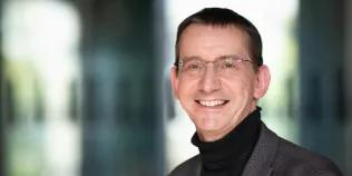 Colour head and shoulders photo of Professor Jeremy Carrette