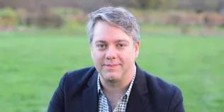 Colour head and shoulders photo of J Thomas Hewitt