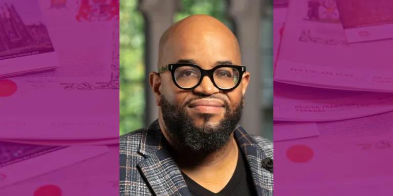 Colour head and shoulders photo of Eric Lewis Williams smiling at the camera
