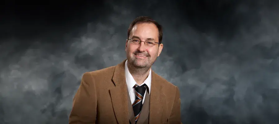Colour head and shoulders photo of Professor Timothy Larsen