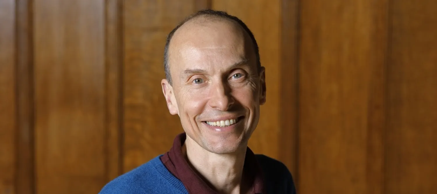 Colour head and shoulders photo of Professor Jolyon Mitchell smiling at the camera