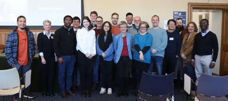 Colour photos of attendees of a CTPI event stood together in Martin Hall smiling at the camera