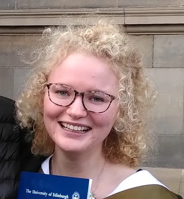 Colour head and shoulders photo of Naomi Reiss