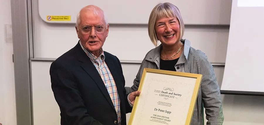 Dr Peter Jupp receiving his framed Lifetime Achievement certificate from Professor Hilary J. Grainger