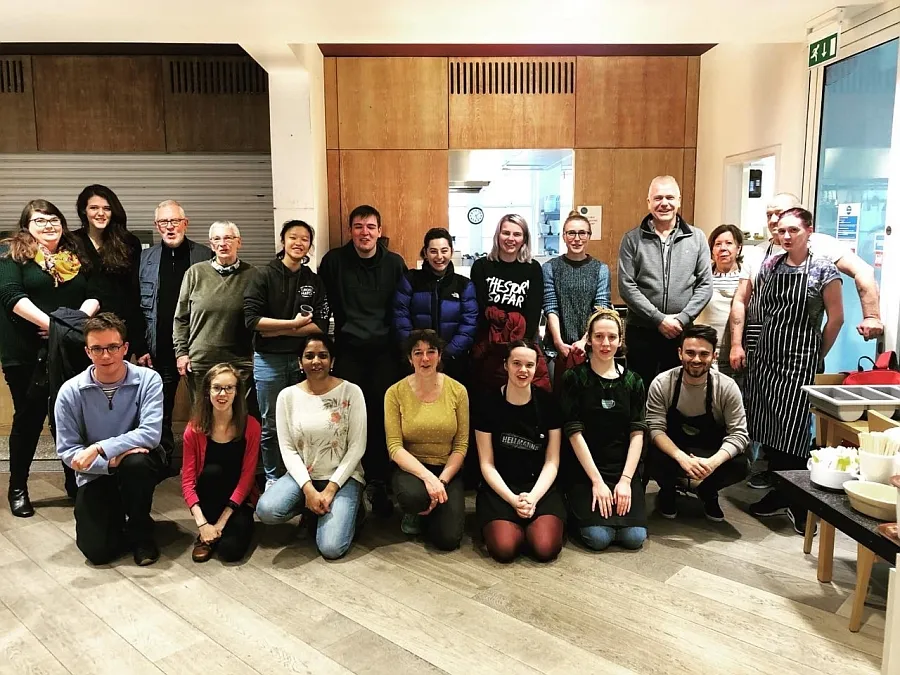 Divinity SERVE students and other Soul Food volunteers, back row standing, other row kneeling in front
