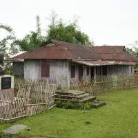 Colour photo of Gaidinliu’s home and a memorial bust at Lungkao village