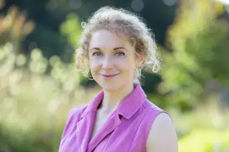 Colour photo of Abi Millar smiling at the camera
