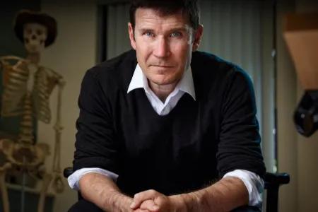 Colour head and shoulders photo of Gavin Francis looking at the camera