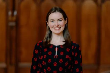 Colour head and shoulders photo of Dr Felicity Loughlin smiling at the camera
