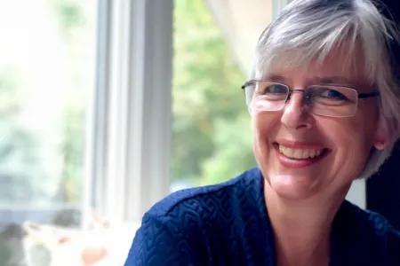 Colour head and shoulders photo of Margaret Somerville smiling at the camera