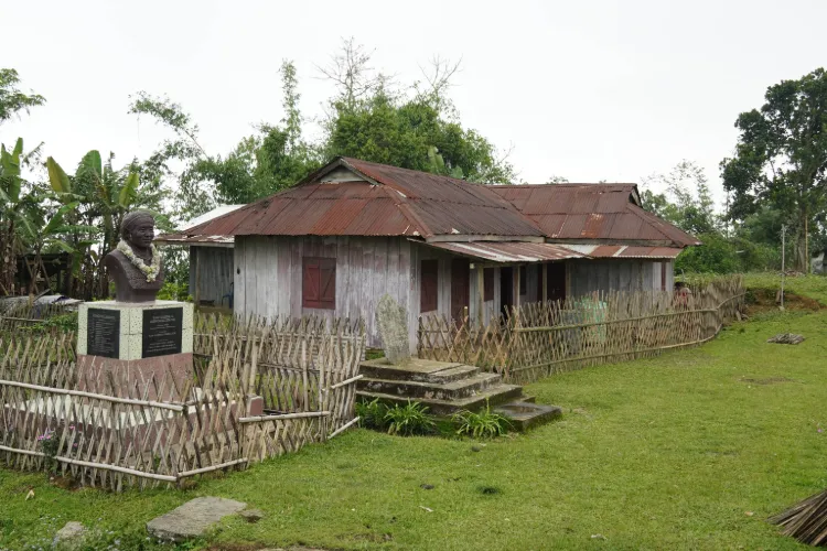 Colour photo of Gaidinliu’s home and a memorial bust at Lungkao village