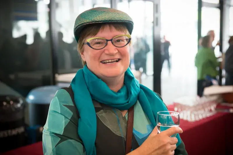 Colour head and shoulders photo of Professor Ann Heirman smiling at the camera