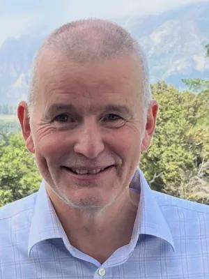 Colour photo of Greg Walker smiling at the camera