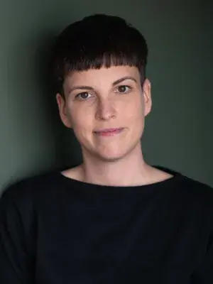 Colour photo of Niamh Ní Mhaoileoin looking at the camera