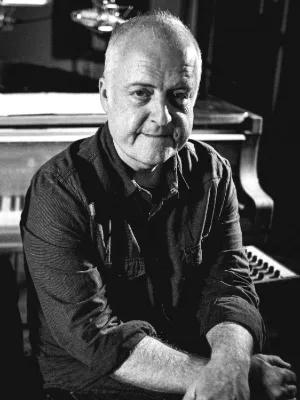 Black and white photo of Dave Milligan looking at the camera