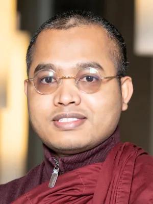 Colour head and shoulders photo of Dr Upali Sraman