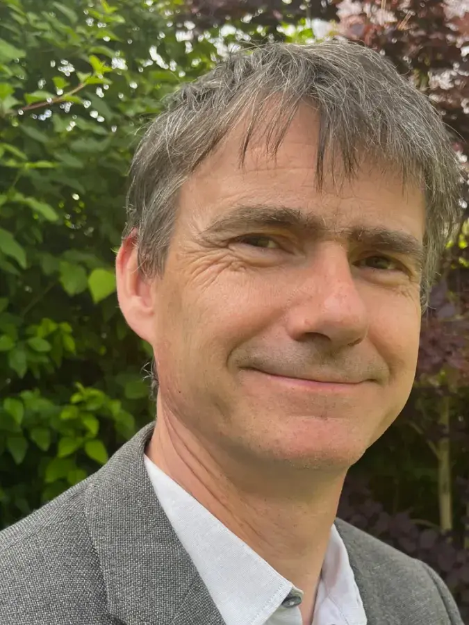 Colour head and shoulders photo of Professor Gordon Lynch smiling at the camera