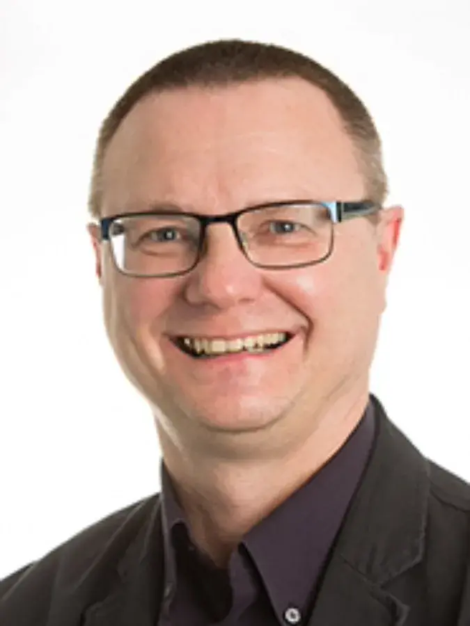 Colour head and shoulders photo of Professor David Tombs