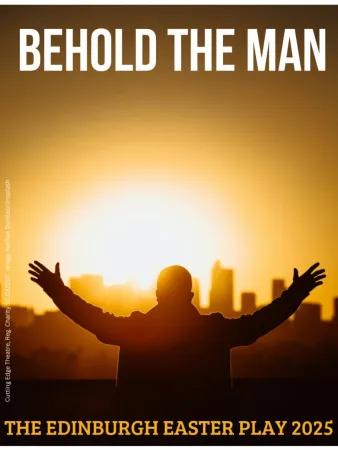 Silhouette of a man with arms raised against a rising sun